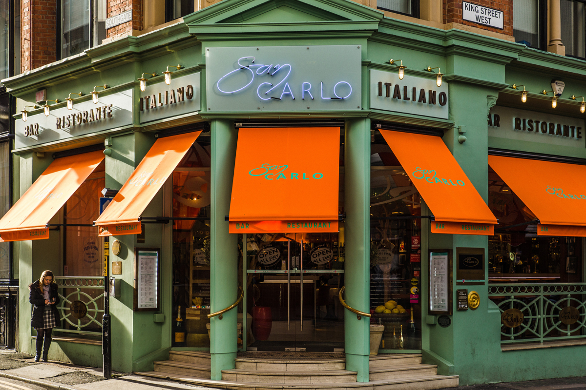 Drop arm awnings